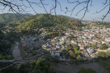 a city view of the town of Tachlieik of Myanmar naxt to the town of Mae Sai in Thailand on the Border to Thailand in the Chiang Rai Province in North Thailand.   Thailand, Mae Sai, November, 2019のeditorial素材