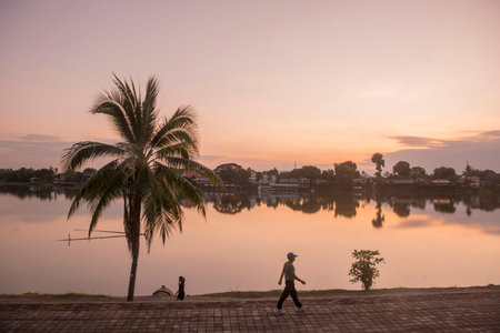 the landscape at the Ping River in the evening in the town of Kamphaeng Phet in the Kamphaeng Phet Province in North Thailand.   Thailand, Kamphaeng Phet, November, 2019のeditorial素材