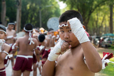 muay Thai boxing boys at the Loy Krathong Festival in the Historical Park in Sukhothai in the Provinz Sukhothai in Thailand.   Thailand, Sukhothai, November, 2019のeditorial素材
