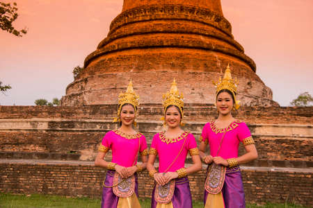 traditional dresst thai people at the Loy Krathong Festival in front of the Wat mahathat in the Historical Park in Sukhothai in the Provinz Sukhothai in Thailand.   Thailand, Sukhothai, November, 2019のeditorial素材