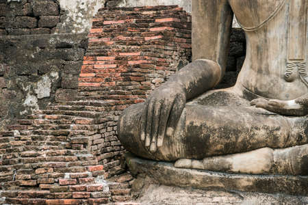 a Buddha statue at the Wat Mahathat Temple at the Historical Park in Sukhothai in the Provinz Sukhothai in Thailand.   Thailand, Sukhothai, November, 2019のeditorial素材