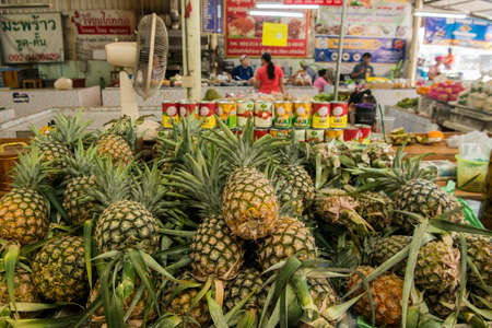 pineapple at the food market street at the Market in the New Sukhothai City in the Provinz Sukhothai in Thailand.   Thailand, Sukhothai, November, 2019のeditorial素材