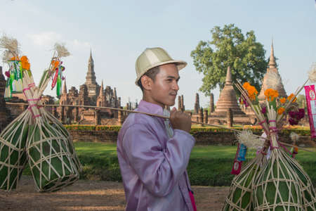 traditional dresst thai people at the Loy Krathong Festival in front of the Wat mahathat in the Historical Park in Sukhothai in the Provinz Sukhothai in Thailand.   Thailand, Sukhothai, November, 2019のeditorial素材