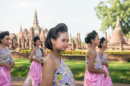 traditional dresst thai people at the Loy Krathong Festival in front of the Wat mahathat in the Historical Park in Sukhothai in the Provinz Sukhothai in Thailand.   Thailand, Sukhothai, November, 2019のeditorial素材