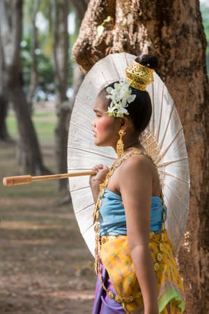 traditional dresst thai people at the Loy Krathong Festival in the Historical Park in Sukhothai in the Provinz Sukhothai in Thailand.   Thailand, Sukhothai, November, 2019のeditorial素材
