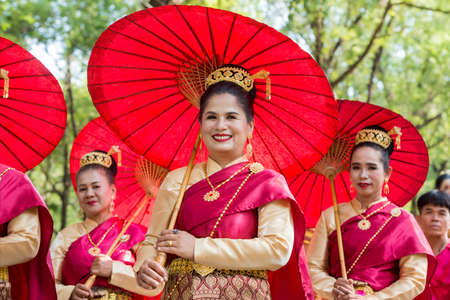traditional dresst thai people at the Loy Krathong Festival in the Historical Park in Sukhothai in the Provinz Sukhothai in Thailand.   Thailand, Sukhothai, November, 2019のeditorial素材