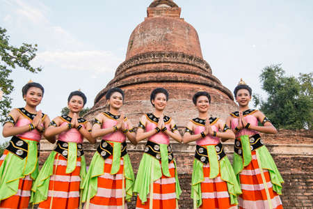 traditional dresst thai people at the Loy Krathong Festival in front of the Wat mahathat in the Historical Park in Sukhothai in the Provinz Sukhothai in Thailand.   Thailand, Sukhothai, November, 2019のeditorial素材