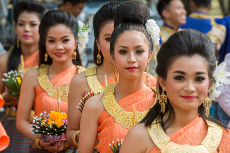 traditional dresst thai people at the Loy Krathong Festival in the Historical Park in Sukhothai in the Provinz Sukhothai in Thailand.   Thailand, Sukhothai, November, 2019のeditorial素材