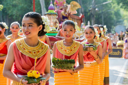 traditional dresst thai people at the Loy Krathong Festival in the Historical Park in Sukhothai in the Provinz Sukhothai in Thailand.   Thailand, Sukhothai, November, 2019のeditorial素材