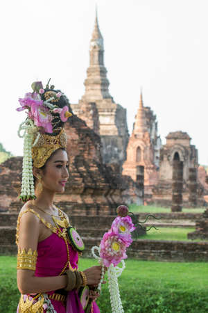 traditional dresst thai people at the Loy Krathong Festival in front of the Wat mahathat in the Historical Park in Sukhothai in the Provinz Sukhothai in Thailand.   Thailand, Sukhothai, November, 2019のeditorial素材