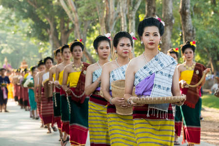 traditional dresst thai people at the Loy Krathong Festival in the Historical Park in Sukhothai in the Provinz Sukhothai in Thailand.   Thailand, Sukhothai, November, 2019のeditorial素材