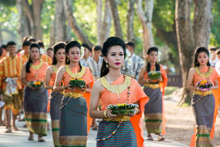 traditional dresst thai people at the Loy Krathong Festival in the Historical Park in Sukhothai in the Provinz Sukhothai in Thailand.   Thailand, Sukhothai, November, 2019のeditorial素材