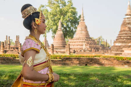 traditional dresst thai people at the Loy Krathong Festival in front of the Wat mahathat in the Historical Park in Sukhothai in the Provinz Sukhothai in Thailand.   Thailand, Sukhothai, November, 2019のeditorial素材