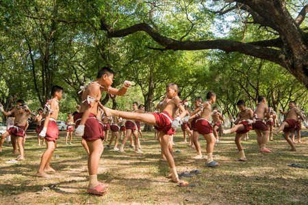 muay Thai boxing boys at the Loy Krathong Festival in the Historical Park in Sukhothai in the Provinz Sukhothai in Thailand.   Thailand, Sukhothai, November, 2019のeditorial素材