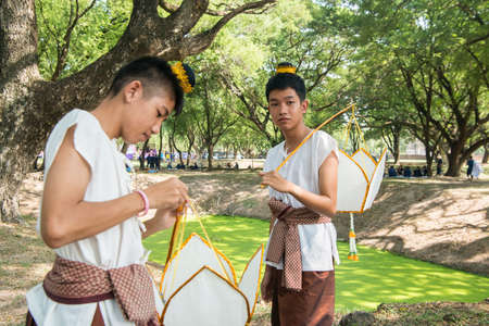 traditional dresst thai people at the Loy Krathong Festival in the Historical Park in Sukhothai in the Provinz Sukhothai in Thailand.   Thailand, Sukhothai, November, 2019のeditorial素材