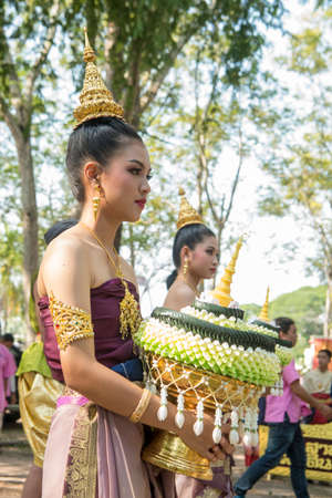 traditional dresst thai people at the Loy Krathong Festival in the Historical Park in Sukhothai in the Provinz Sukhothai in Thailand.   Thailand, Sukhothai, November, 2019のeditorial素材