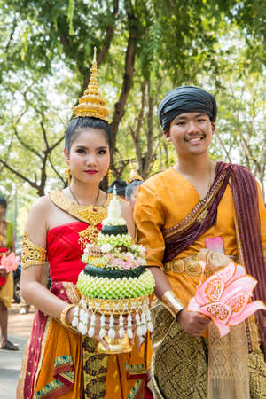 traditional dresst thai people at the Loy Krathong Festival in the Historical Park in Sukhothai in the Provinz Sukhothai in Thailand.   Thailand, Sukhothai, November, 2019のeditorial素材