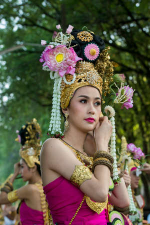 traditional dresst thai people at the Loy Krathong Festival in the Historical Park in Sukhothai in the Provinz Sukhothai in Thailand.   Thailand, Sukhothai, November, 2019のeditorial素材