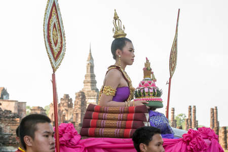traditional dresst thai people at the Loy Krathong Festival in front of the Wat mahathat in the Historical Park in Sukhothai in the Provinz Sukhothai in Thailand.   Thailand, Sukhothai, November, 2019のeditorial素材