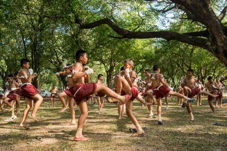 muay Thai boxing boys at the Loy Krathong Festival in the Historical Park in Sukhothai in the Provinz Sukhothai in Thailand.   Thailand, Sukhothai, November, 2019のeditorial素材