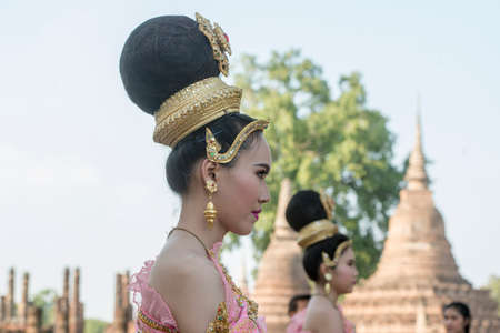 traditional dresst thai people at the Loy Krathong Festival in front of the Wat mahathat in the Historical Park in Sukhothai in the Provinz Sukhothai in Thailand.   Thailand, Sukhothai, November, 2019のeditorial素材