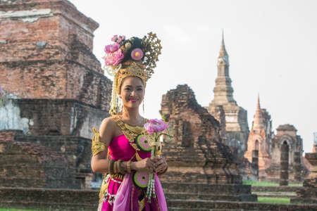 traditional dresst thai people at the Loy Krathong Festival in front of the Wat mahathat in the Historical Park in Sukhothai in the Provinz Sukhothai in Thailand.   Thailand, Sukhothai, November, 2019のeditorial素材