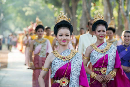 traditional dresst thai people at the Loy Krathong Festival in the Historical Park in Sukhothai in the Provinz Sukhothai in Thailand.   Thailand, Sukhothai, November, 2019のeditorial素材
