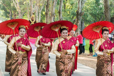 traditional dresst thai people at the Loy Krathong Festival in the Historical Park in Sukhothai in the Provinz Sukhothai in Thailand.   Thailand, Sukhothai, November, 2019のeditorial素材