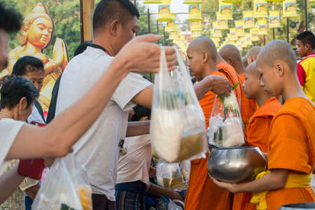 a buddhism Monk ceremony at the Loy Krathong Festival in the Historical Park in Sukhothai in the Provinz Sukhothai in Thailand.   Thailand, Sukhothai, November, 2019のeditorial素材