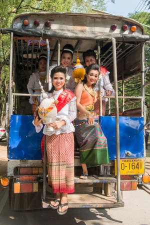 traditional dresst thai people at the Loy Krathong Festival in the Historical Park in Sukhothai in the Provinz Sukhothai in Thailand.   Thailand, Sukhothai, November, 2019のeditorial素材