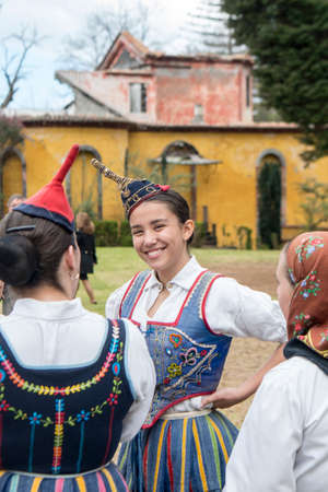 People in traditional dress in front of the Quinta Jardins do Imperador on the reopening of the Emperior Gardens at Monte near the city centre of Funchal on the Island Madeira of Portugal.   Portugal, Madeira, April 2018のeditorial素材