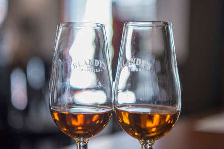 a glass portwine at the Madeira wine company of Blandys in the city centre of Funchal on the Island Madeira of Portugal.   Portugal, Madeira, April 2018のeditorial素材