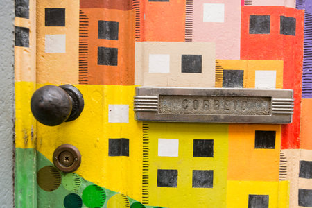 street  and wall art at the old houses in the old town of zona Velha in the old city of Funchal at...