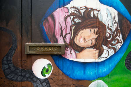 street  and wall art at the old houses in the old town of zona Velha in the old city of Funchal at night on the Island Madeira of Portugal.   Portugal, Madeira, April 2018のeditorial素材