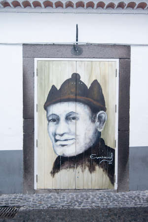 street  and wall art at the old houses in the old town of zona Velha in the old city of Funchal at night on the Island Madeira of Portugal.   Portugal, Madeira, April 2018のeditorial素材