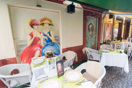 street  and wall art at the old houses in the old town of zona Velha in the old city of Funchal at night on the Island Madeira of Portugal.   Portugal, Madeira, April 2018のeditorial素材