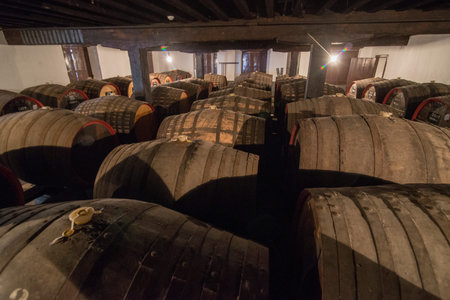 the wine barrel at the wine cellar in the Madeira wine company of Blandys in the city centre of...