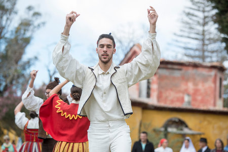 People in traditional dress in front of the Quinta Jardins do Imperador on the reopening of the...
