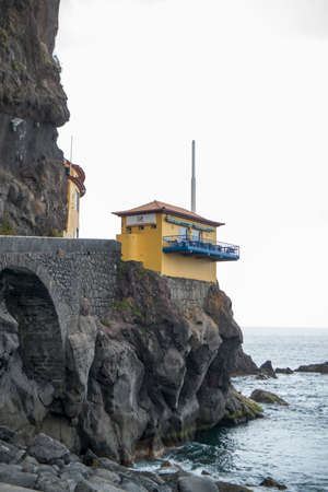 a resraurant on the cliffs and coast at the town of Ponta do Sol, west of Funchal on the Island Madeira of Portugal.   Portugal, Madeira, April 2018のeditorial素材