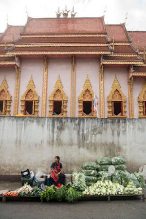 the marketstreet in front of the Wat Mung Muang at the Kad Luang Market in the city of Chiang Rai in North Thailand.  Thailand, Chiang Rai, November, 2019のeditorial素材