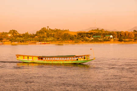 a sunset at the mekong river in the town of Chiang Saen in the north of the city Chiang Rai in North Thailand.   Thailand, Chiang Sean, November, 2019のeditorial素材