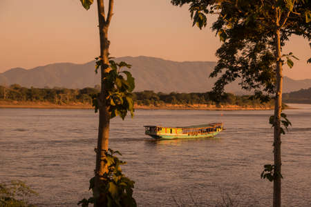 a sunset at the mekong river in the town of Chiang Saen in the north of the city Chiang Rai in North Thailand.   Thailand, Chiang Sean, November, 2019のeditorial素材