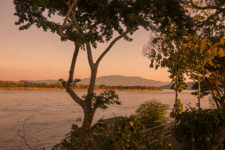 a sunset at the mekong river in the town of Chiang Saen in the north of the city Chiang Rai in North Thailand.   Thailand, Chiang Sean, November, 2019のeditorial素材