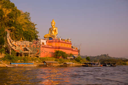 the Giant Buddha on the Dragon Boat Temple at the Mekong River in the town of Sop Ruak in the golden triangle in the north of the city Chiang Rai in North Thailand.   Thailand, Chiang Sean, November, 2019のeditorial素材