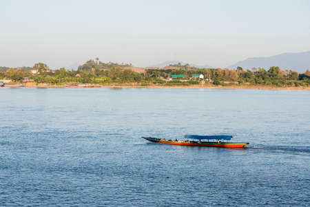 a sunset at the mekong river in the town of Chiang Saen in the north of the city Chiang Rai in North Thailand.   Thailand, Chiang Sean, November, 2019のeditorial素材