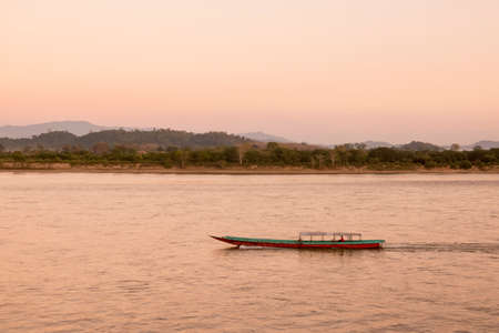 a sunset at the mekong river in the town of Chiang Saen in the north of the city Chiang Rai in North Thailand.   Thailand, Chiang Sean, November, 2019のeditorial素材