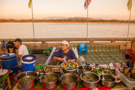 street food at a Satuday night market at the mekong river in the town of Chiang Saen in the north of the city Chiang Rai in North Thailand.   Thailand, Chiang Sean, November, 2019のeditorial素材