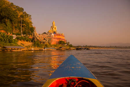 the Giant Buddha on the Dragon Boat Temple at the Mekong River in the town of Sop Ruak in the golden triangle in the north of the city Chiang Rai in North Thailand.   Thailand, Chiang Sean, November, 2019のeditorial素材