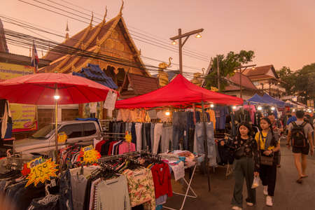 the Wat Pha Khaopan at the Satuday night market at the mekong river in the town of Chiang Saen in the north of the city Chiang Rai in North Thailand.   Thailand, Chiang Sean, November, 2019のeditorial素材