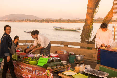 street food at a Satuday night market at the mekong river in the town of Chiang Saen in the north of the city Chiang Rai in North Thailand.   Thailand, Chiang Sean, November, 2019のeditorial素材